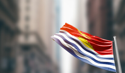 Kiribati national flag waving on street. A beautiful with mast with blur buildings. Kiribati national flag for independence day.