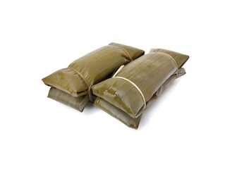 Pesor or Indonesian traditional food made from rice and wrapped in banana leaves, isolated on white background