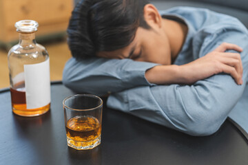 Health care alcoholism drunk, fatigue asian young man holding glass of whiskey, depressed male...