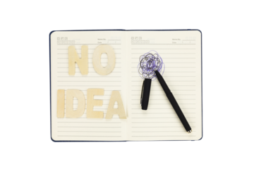 No idea, creative block and writer's frustration concept. Mental block, stress and confusion with a scribble on a notebook isolated on white background with clipping path.