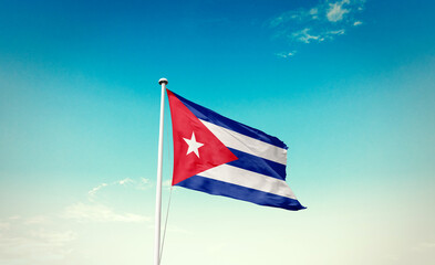 Cuba national flag waving in blue sky.