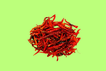 Naklejka premium Dried chili pepper, chillies spicy. Isolated on green Background 