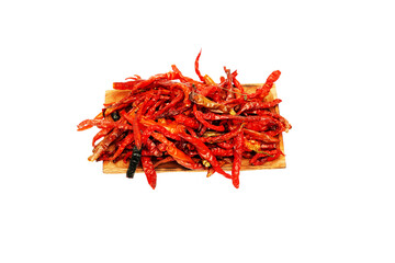 Dried chili pepper, chillies spicy served on wooden plate. Isolated on white background 