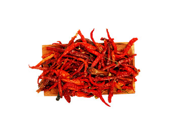 Dried chili pepper, chillies spicy served on wooden plate. Isolated on white background 