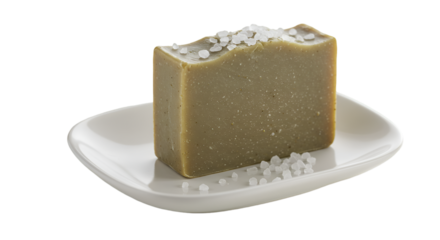 Luxurious olive green soap resting elegantly on a pristine white dish sprinkled with sea salt