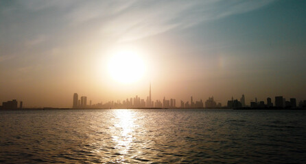 Fototapeta premium Beautiful sunset view of the Dubai skyline with Burj Khalifa silhouette.