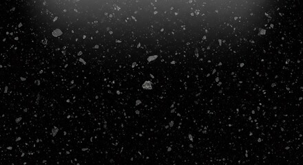Dark Speckled Surface with Subtle Light Gradient and Reflective Particles