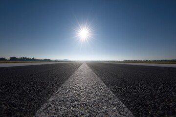 Empty runway, sunlit, bright
