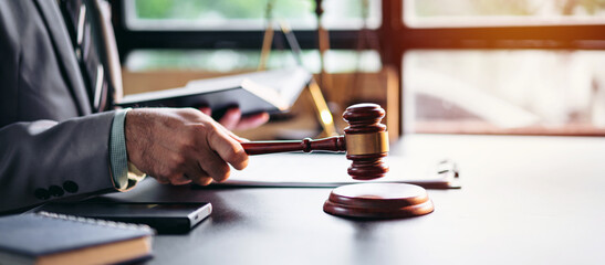 Gavel Hammer for Law Legal Courtroom Auction and Judgement Concept with Adult Asian Man Holding...