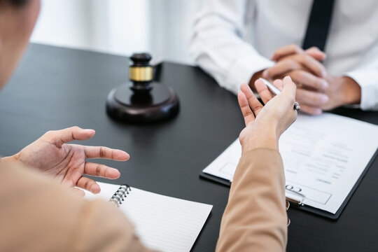 Consultation and conference of Male lawyer and professional businessman working and discussion having at law firm in office, Law and Legal services concept