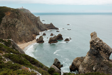 Fototapeta premium Ursa Beach near Cabo da Roca in Portugal is a secluded wild beach with dramatic cliffs, unique rock formations, and Atlantic waves. High quality stock photo