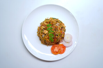 Vegetable Kottu with Tomato Slices, Onion Slices, and Curry Leaves.