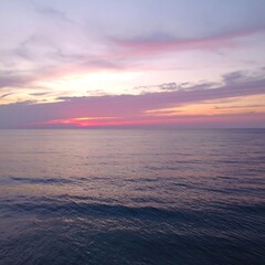 Blurry sunset over a placid ocean