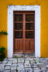Wooden door with white stone frame in Yucatan hacienda