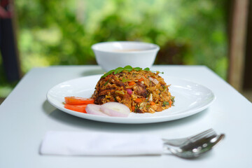 srilankan food of kottu on the white table. spoon, fork, gravy white bowl. food photography.
