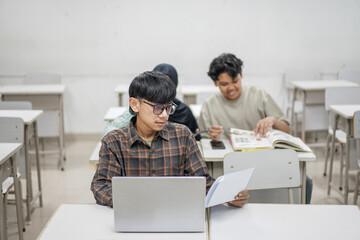 A group of diverse young students diligently engaged in a collaborative learning environment within...