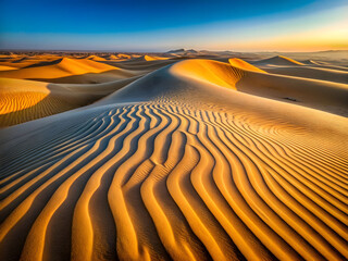 Naklejka premium Golden desert dunes at sunset intricate wind patterns warm light vibrant sky breathtaking timeless wilderness photography