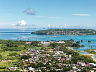 Aerial View of Kouri Island (古宇利島) and Kouri Bridge (古宇利大橋) with Village and Coastal Lagoon, Okinawa, Japan