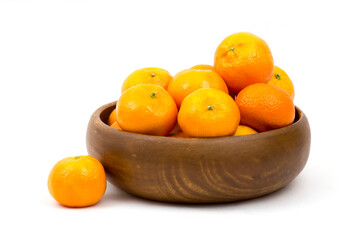 tangerines in a bowl on white background