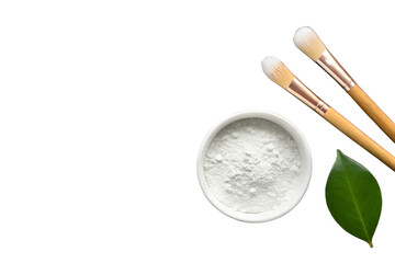 Elevate your skincare ritual with natural ingredients Organic powder mask, gentle brushes, and a fresh leaf for a pure, revitalizing beauty experience