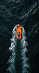Aerial view of a small, vibrant orange boat cutting through dark, churning water, leaving a foamy wake