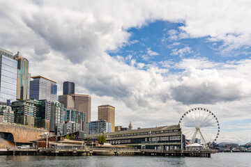 Seattle, WA, USA-August 17, 2025: Seattle skyline with Aquarium located on the city's vibrant newly renovated waterfront district.