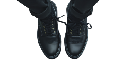 Illustration of topdown view of a pair of black leather boots with laces and trousers isolated on transparent background, showcasing the design for outdoor activities and casual style