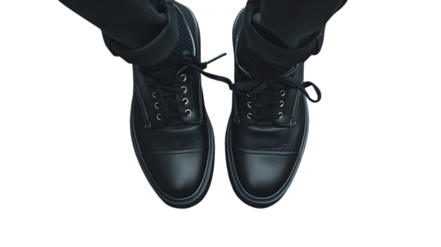 Illustration of topdown view of a pair of black leather boots with laces and trousers isolated on transparent background, showcasing the design for outdoor activities and casual style
