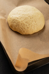 Dough raw cooking yeast, flour, water tasty snack fresh delicious gourmet food background on the table rustic food top view copy space