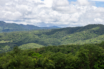 Obraz premium Beautiful green mountain landscape with clouds and summer sky