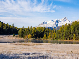 St. Moritz, Switzerland - October 6th 2024: Idyllic lake Lej da Staz in the morning sunlight