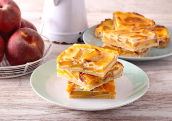 Peach cream  slices stacked on plate