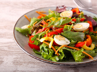 Fresh vegetable and quail eggs salad