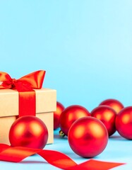 Christmas gift box and ornaments on a light blue background