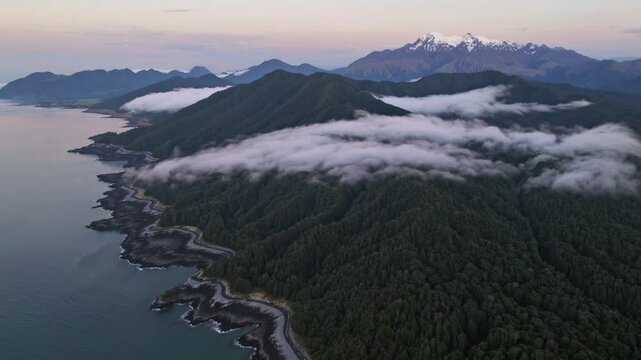 Early Morning Mist at the New Zealand West Coast with Vista of Mount Tasman