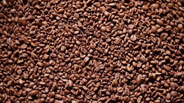 Top-down close-up graphic view of ground coffee beans showcasing texture and detail texture