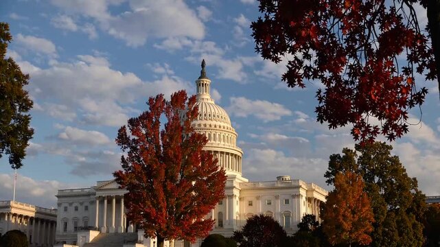 The legislative building of North American federal government during the season of fall, surrounded by trees with changing leaves