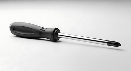 A black handled screwdriver on a white surface