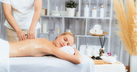 Caucasian woman customer enjoying relaxing anti-stress spa massage and pampering with beauty skin...