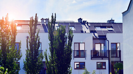Harmony with nature, eco architecture. Terraced single family homes in newly developed housing estate. The real estate market in the suburbs with lush greenery surrounding. 