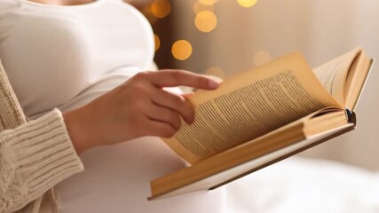 Pregnant woman reading book - Powered by Adobe