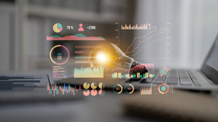 Modern data analysis concept showing light bulb and graphs on laptop. This image represents innovative technology, business insights, and digital transformation. Impute