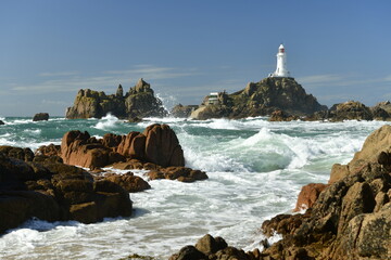 Jersey, U.K. La Corbiere point. Dramatic stormy sea in the Summer.