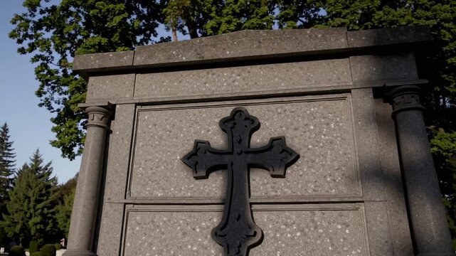 The Silhouette Cast by Religious Symbol onto Flat Grave Marker in Burial Ground