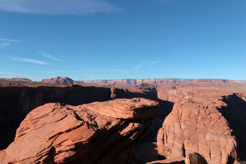 The picturesque landscape of Arizona in the valley of the Colorado River. The red mountains are clearly visible against the blue sky
