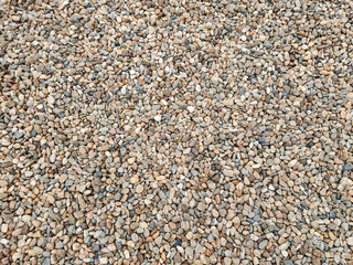 Colorful stone pebbles on the beach, summer vacation texture background