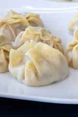 Steamed Delights: Fluffy Uyghur Momo Served with Soy Sauce