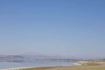 Midday Serenity by the Lake A Majestic View Framed by Mountains sun