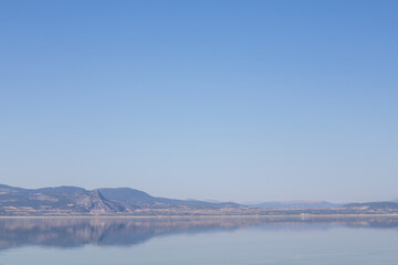 Midday Serenity by the Lake A Majestic View Framed by Mountains sun