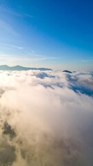 High-altitude view of clouds over mountains